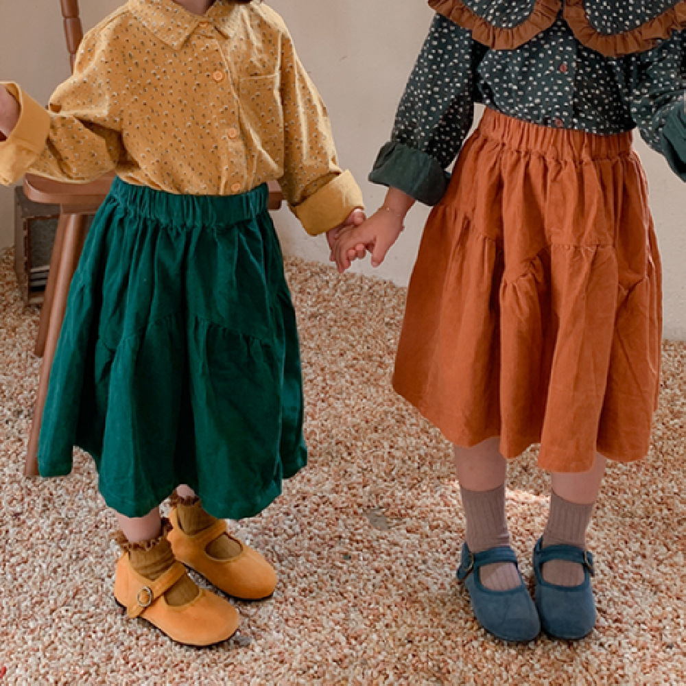 韓国子供服女の子のスカートの新型韓国版子供服のコーデュロイのゆるいロングスカート綿