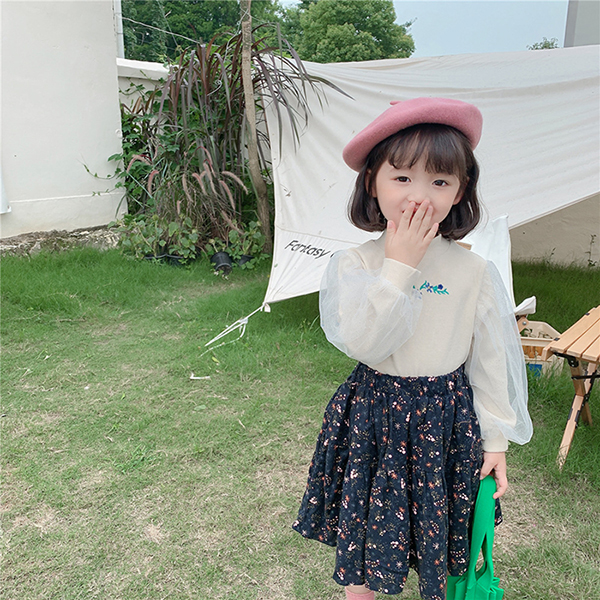韓国子供服春の新型のボトムシャツは上着の網の袖の半身のスカートのプリンセスのスカートを厚くします