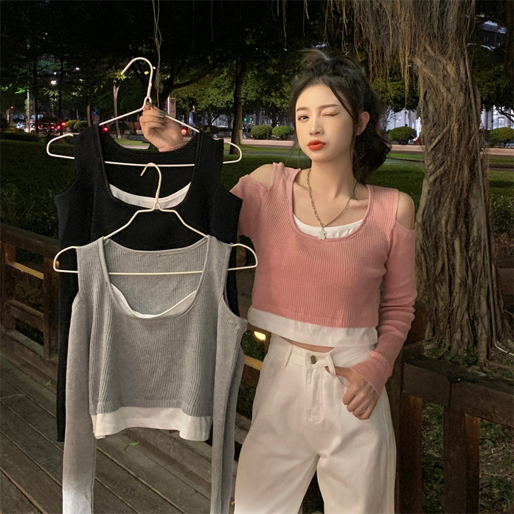 春と秋の韓国版の新型長袖のニットウェアの偽の肩の露出機は上着の女性を打ちます