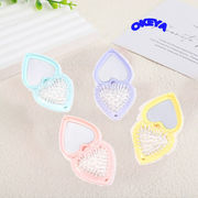 折りたたみ鏡　櫛付き　ミニサイズ　ヘアケア　ヘアブラシ　くし　ハート型　マカロン　4色展開